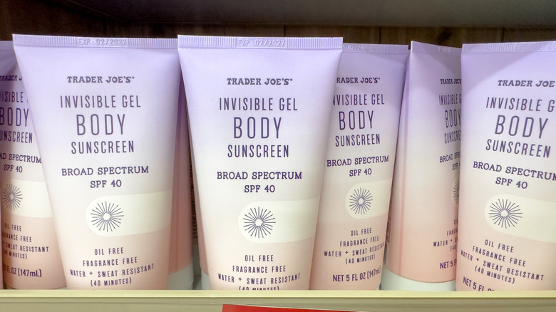 Tubes of Trader Joe's invisible gel body sunscreen on the store shelf