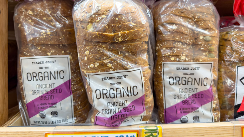 Packages of Trader Joe's organic ancient grain & seed bread on the shelf