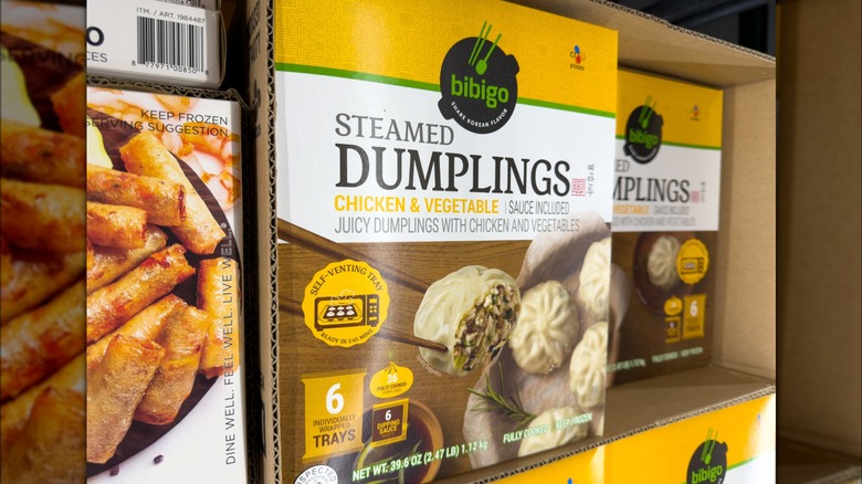 Freezer shelf featuring cases of Bibigo Steamed Dumplings