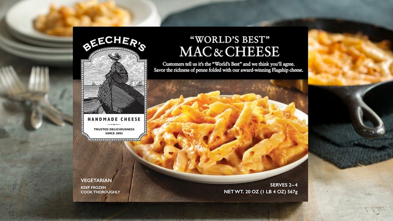 Box of Beecher's "World's Best" Mac & Cheese in front of bowl and iron skillet full of mac & cheese