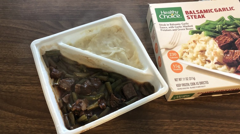 Healthy Choice balsamic garlic steak frozen meal in tray.