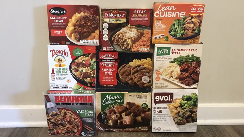 9 boxes of frozen steak dinners stopped on top of each other.