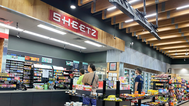 Customers wait inside a Sheetz gas station and convenience store