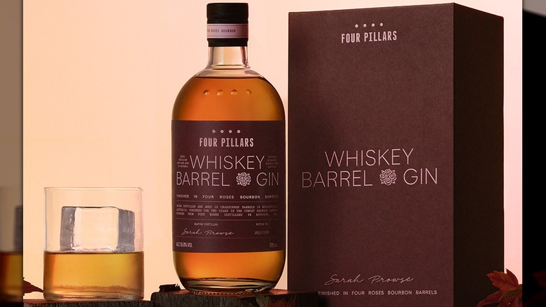 Four Pillars Whiskey Barrel gin bottle, box, and glass