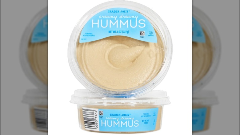 Two tubs of Trader Joe's hummus stacked on top of each other