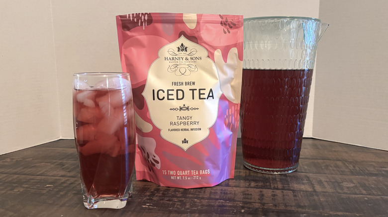 Harney & Sons Tangy Raspberry iced tea in package, glass, and pitcher.