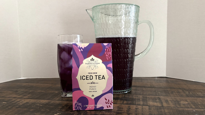 Harney & Sons Indigo Punch iced tea in package, glass, and pitcher.