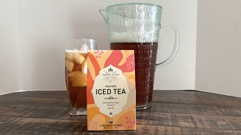 Harney & Sons Invigorating Peach iced tea in package, glass, and pitcher.