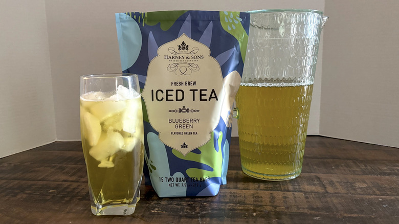 Harney & Sons Blueberry Green iced tea in package, glass, and pitcher.