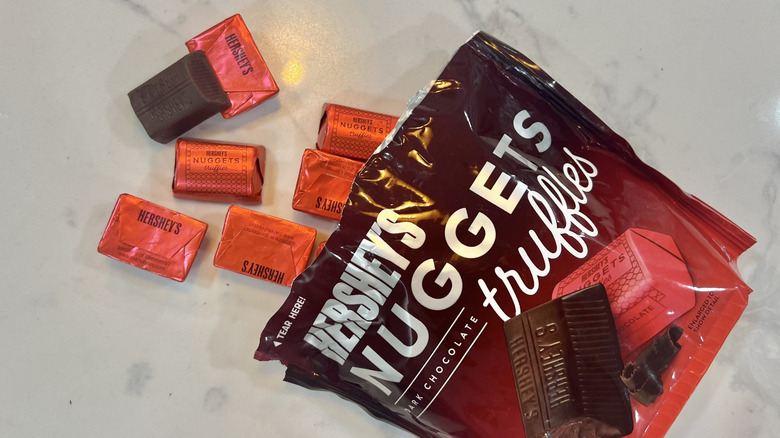 Hershey's Nuggets Dark Chocolate Truffles coming out of bag.