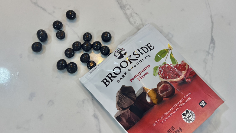 Brookside pomegranate chocolate balls coming out of bag.