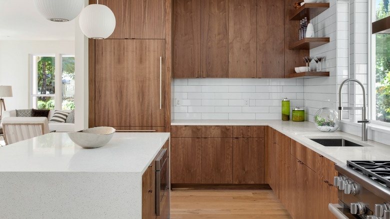 wood cabinets with white countertop in kitchen