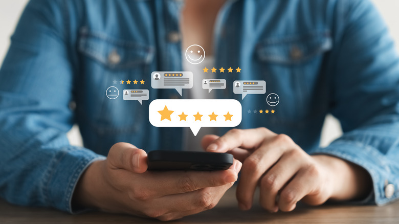 Customer giving 5-star rating for a restaurant from the phone