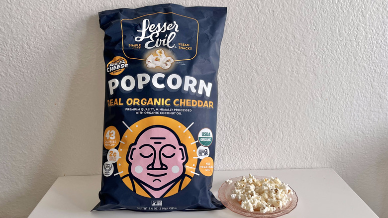 Real Organic Cheddar bag with some popcorn on a plate