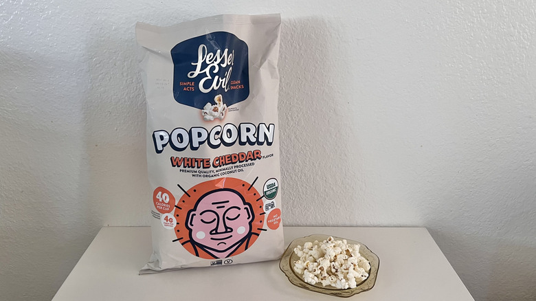Bag of White Cheddar with popcorn on a plate