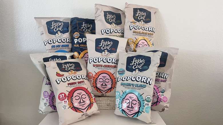 Nine LesserEvil popcorn flavors on a table