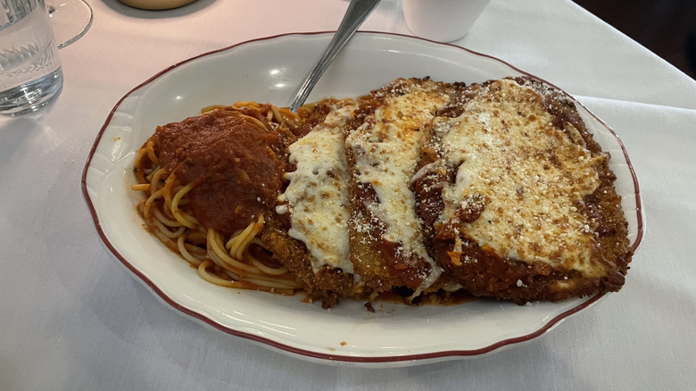 Eggplant parmesan and spaghetti with marinara sauce on a plate