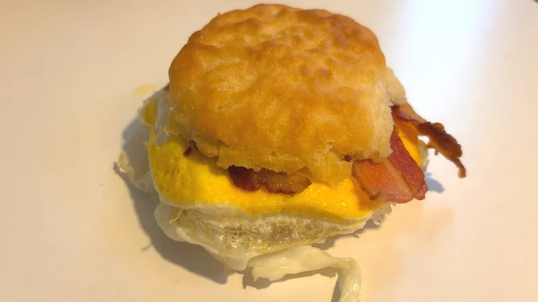Bacon, egg, and cheese biscuit on a plate