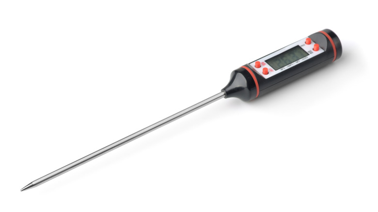 Digital meat thermometer on white background