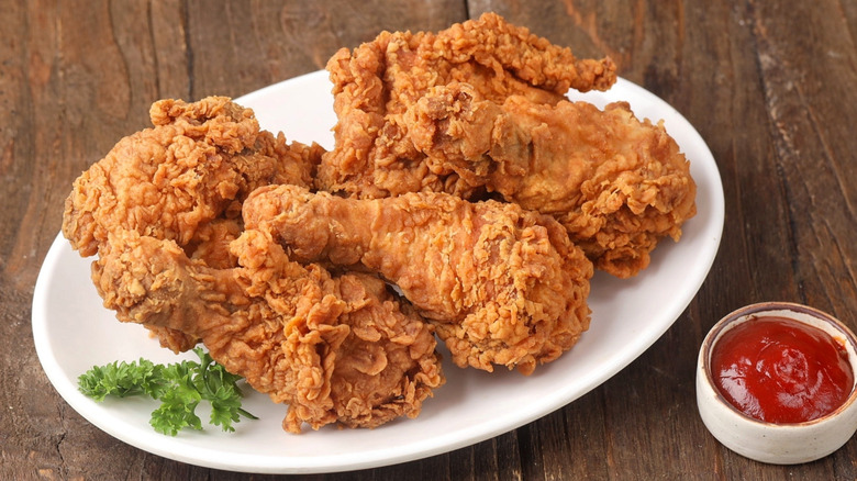 Crispy fried chicken on white plate