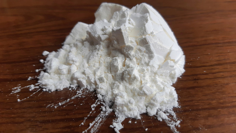 cornstarch on a wooden cutting board