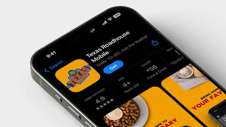Phone showing Texas Roadhouse app on white background