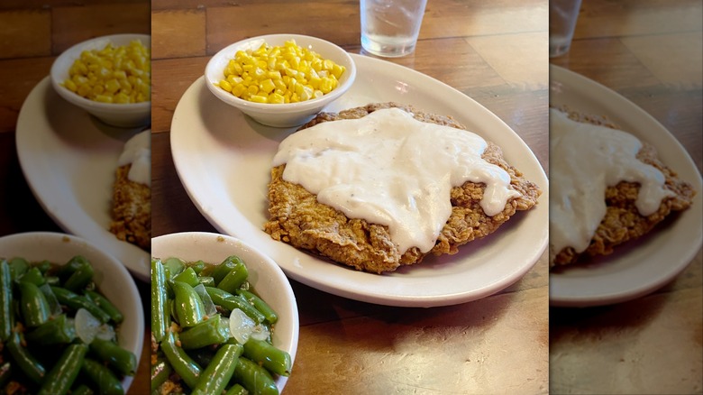 Texas Roadhouse country fried chicken on white plate with sides