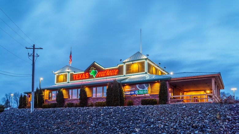 Texas Roadhouse building against deep blue sky