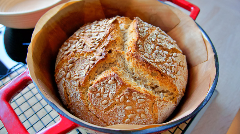 Freshly baked bread in red Dutch oven