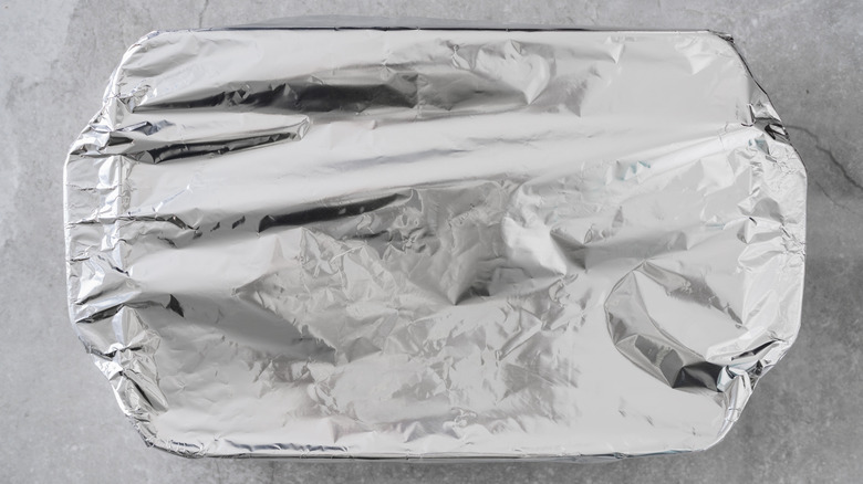 Baking dish covered with aluminum foil