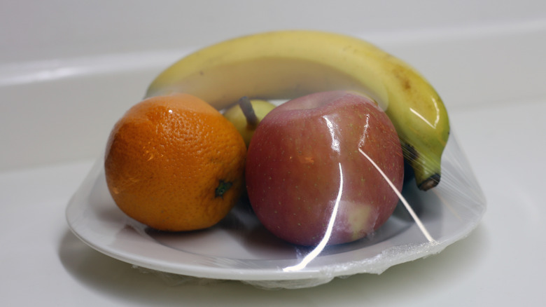 Plate of hotel-wrapped fruit