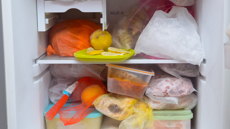 Crowded freezer packed with food