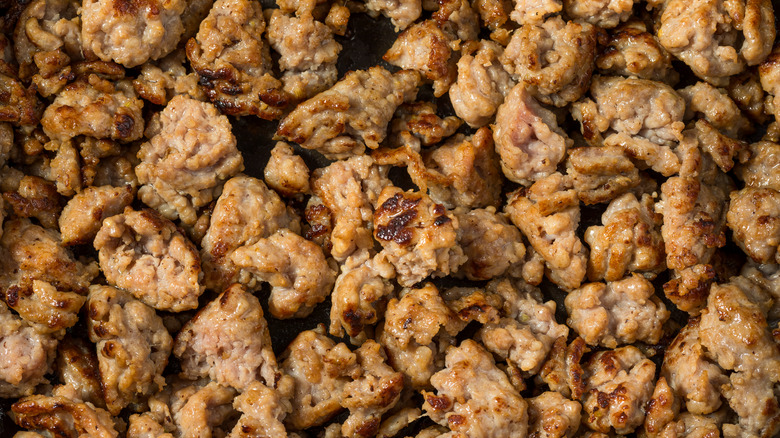 Sausage browning in pan