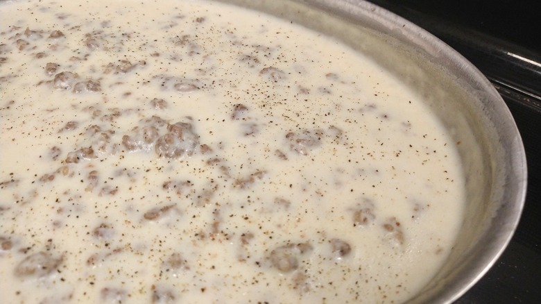Sausage gravy cooking in pan