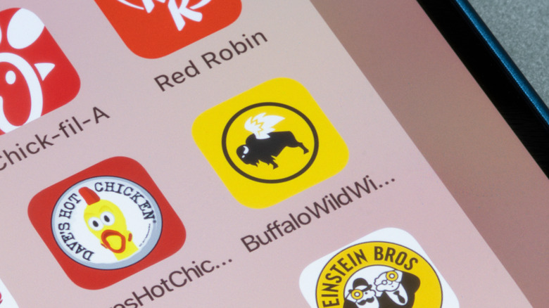 Food app icons, including BWW app, on phone
