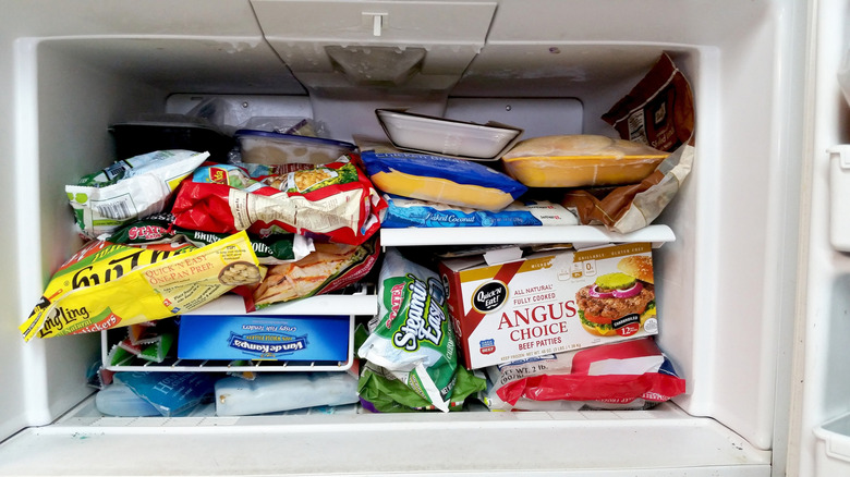 Messy freezer full of food