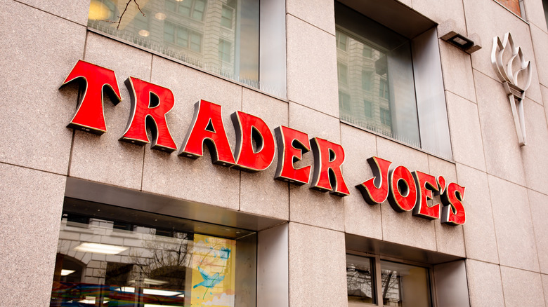 Exterior facade of a Trader Joe's grocery store with its logo sign
