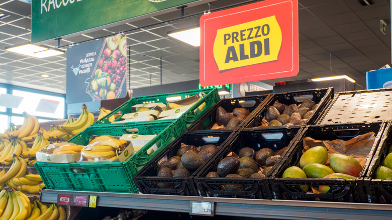 produce arranged in black crates on metal shelving in Aldi