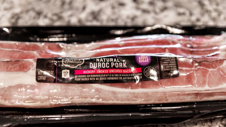 package of uncured bacon, from a major American supermarket chain, shown on a granite countertop