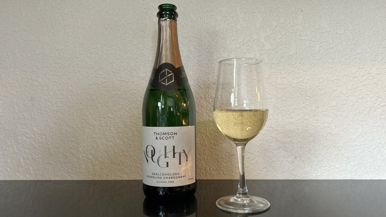 A bottle and glass of Noughty Non-Alcoholic Sparkling Chardonnay