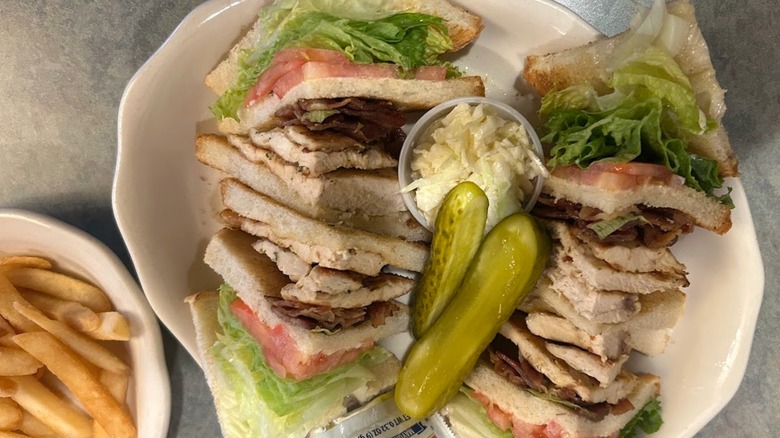 plate of double decker sandwiches from a diner