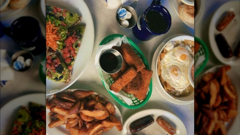 aerial view of food filling a table at a diner