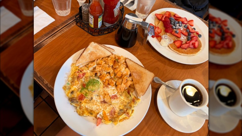diner table filled with breakfast dishes
