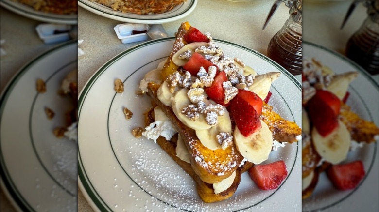 large plate of french toast with various toppings