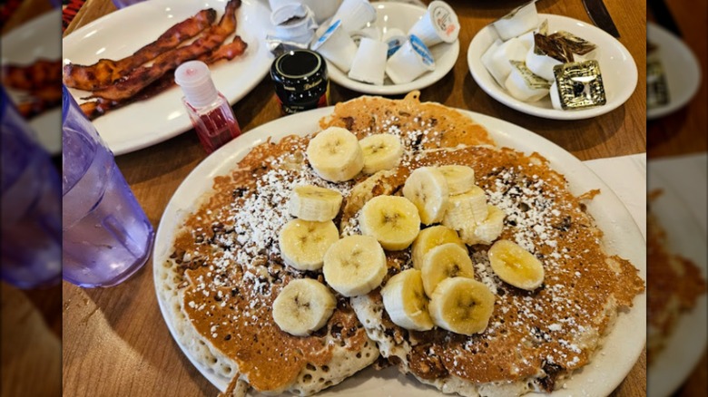 plate of banana chocolate chip pancakes from a diner