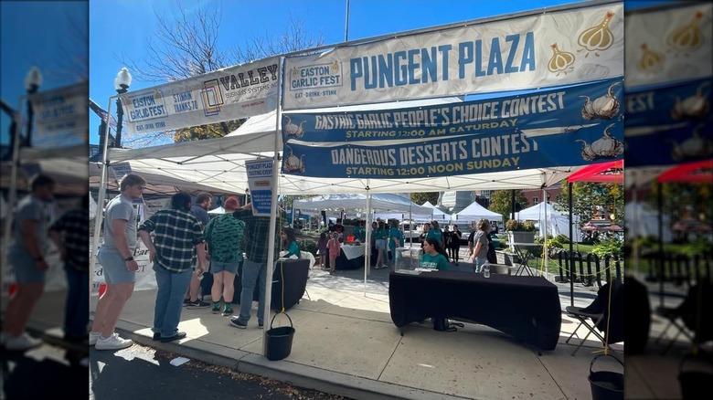 a sign for pungent plaza at the easton garlic fest