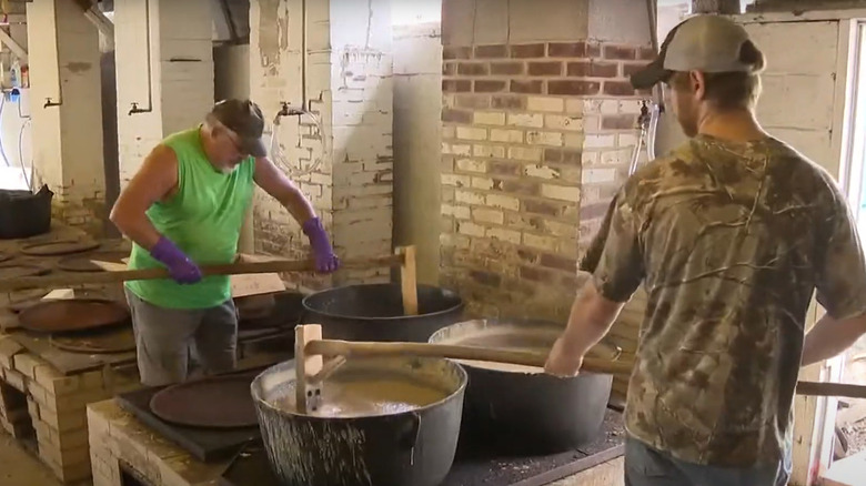 volunteers stirring pots of bean soup for the McClure Bean Soup Fair