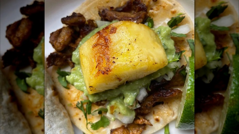 Pineapple chunk on a meat taco