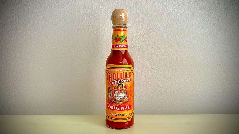 An unopened bottle of Cholula Hot Sauce
