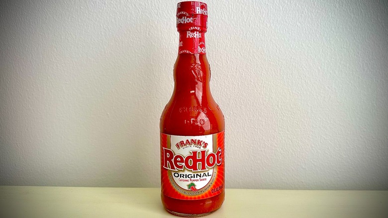 An unopened bottle of Frank's Hot Sauce